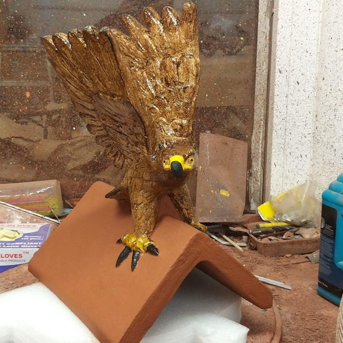 Hawk hand painted roof finial in the workshop
