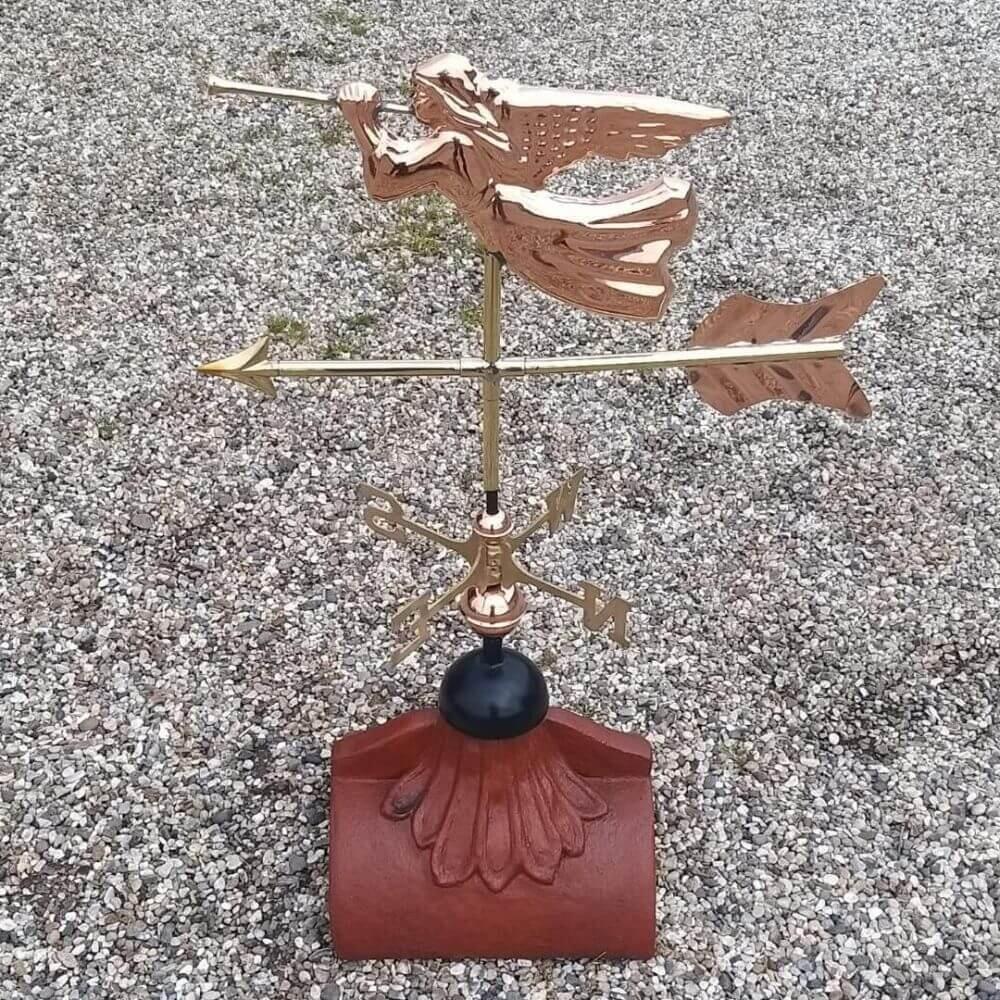 Angel weathervane installed on a roof tile