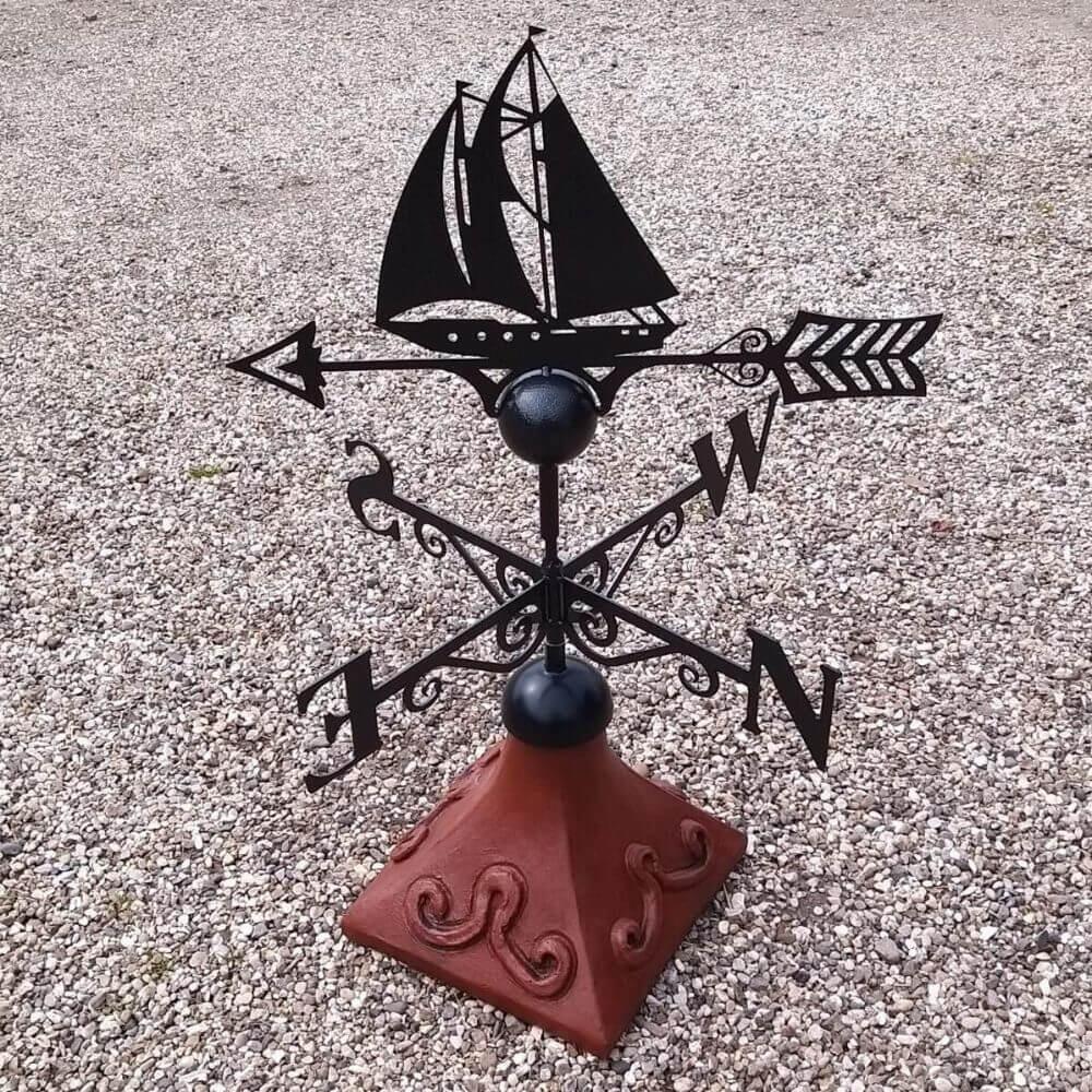 Sailboat weathervane fitted to a square ridge tile