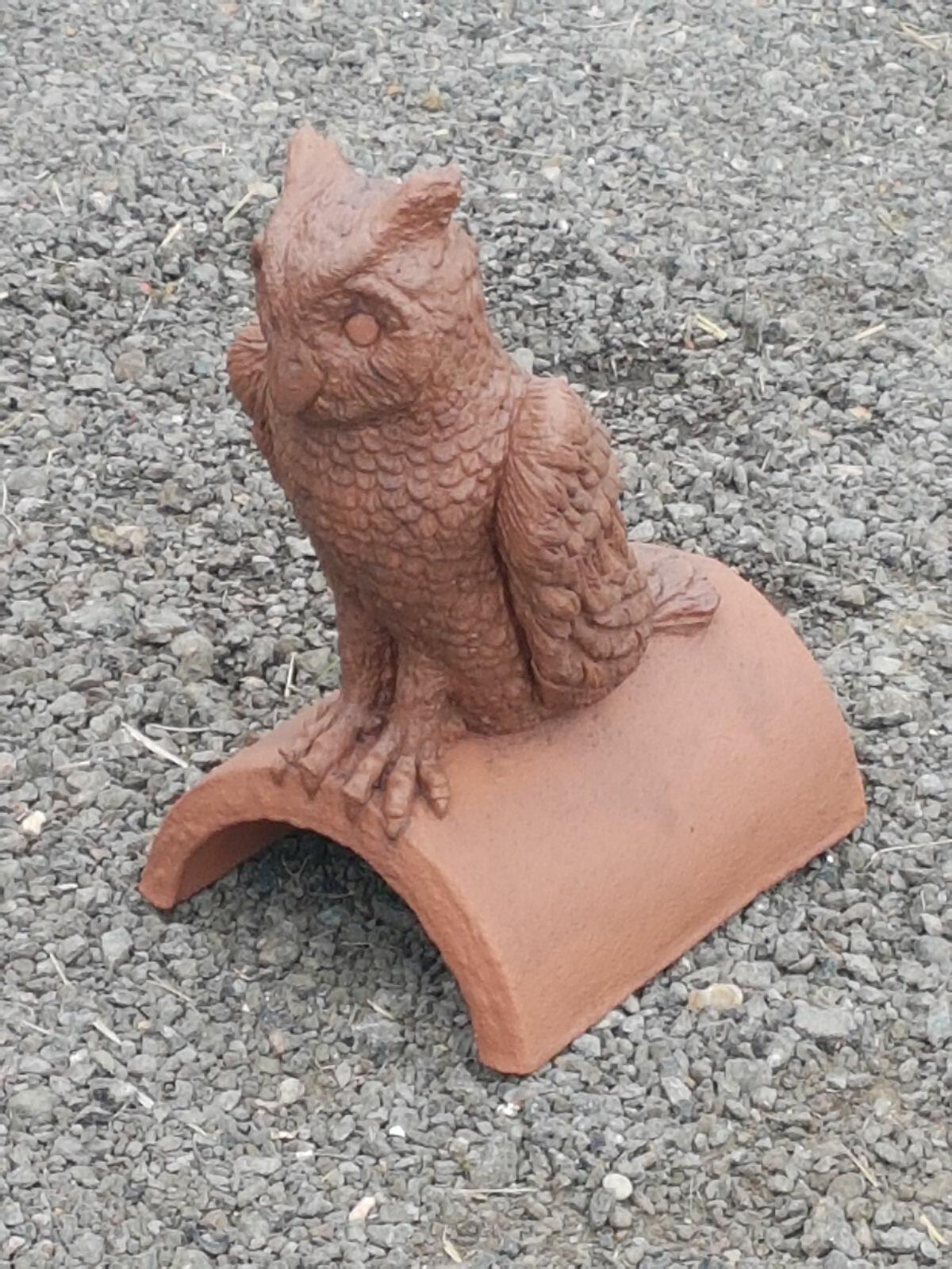 a terracotta owl roof finial with two colours