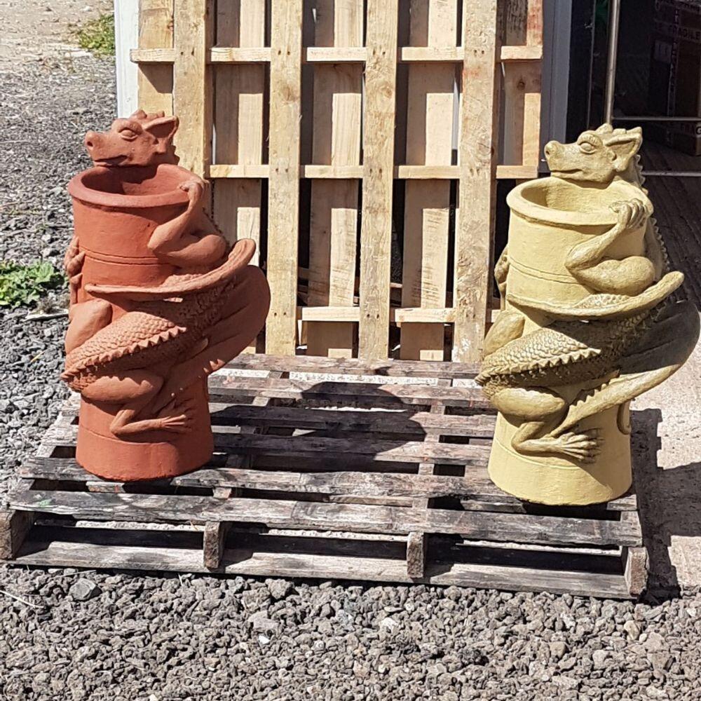 Pallet with two dragon chimney pots on it