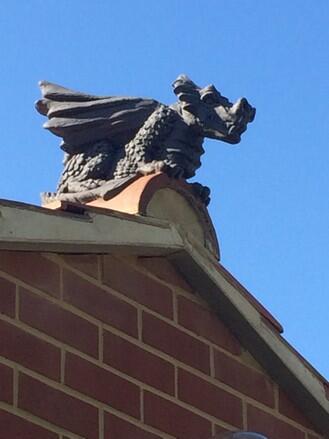 Winged Dragon finial on gable end extension roof