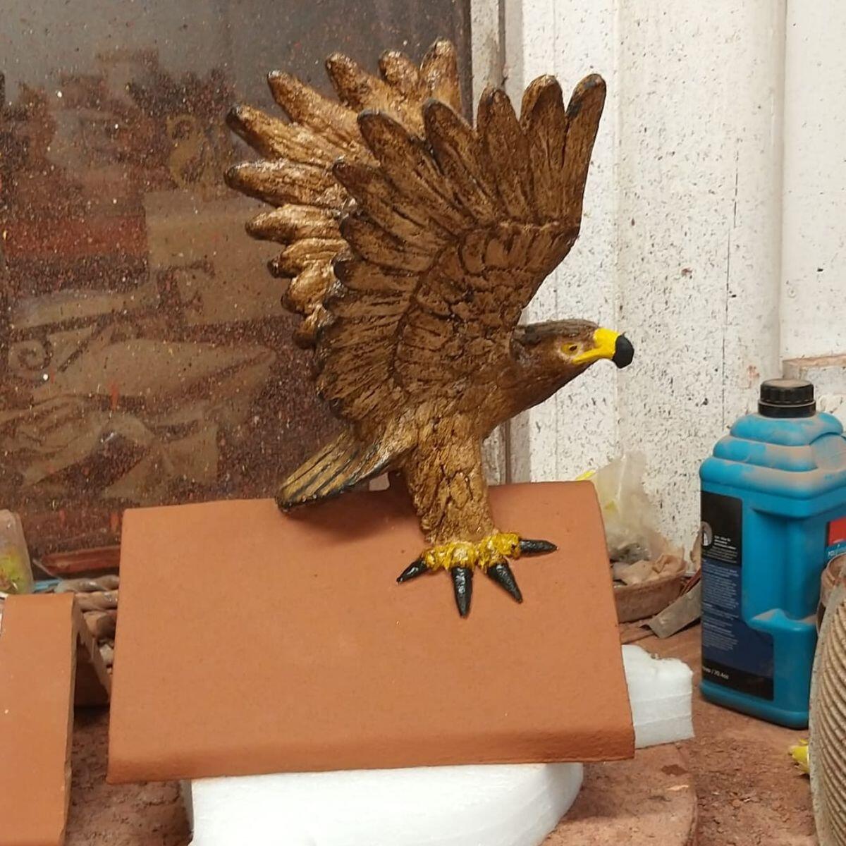 Hawk handpainted roof finial pictured in the workshop