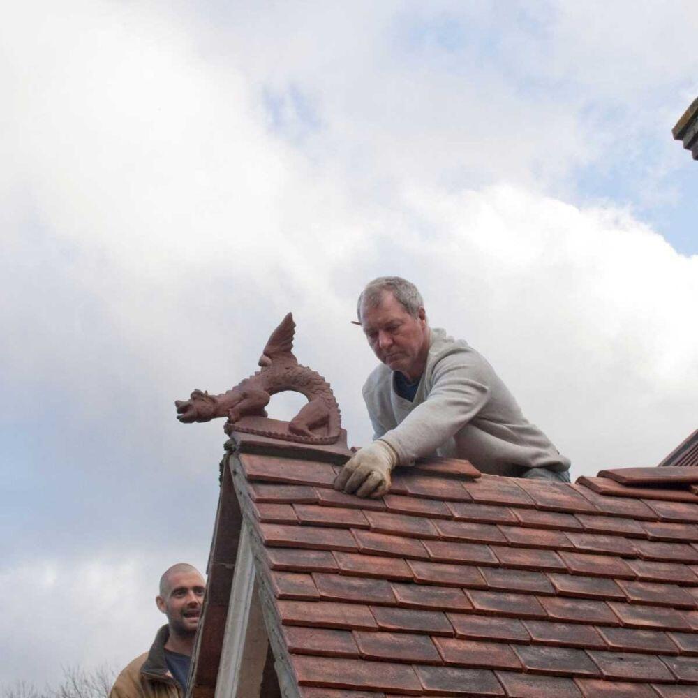 Small roof dragon being installed by a roofer