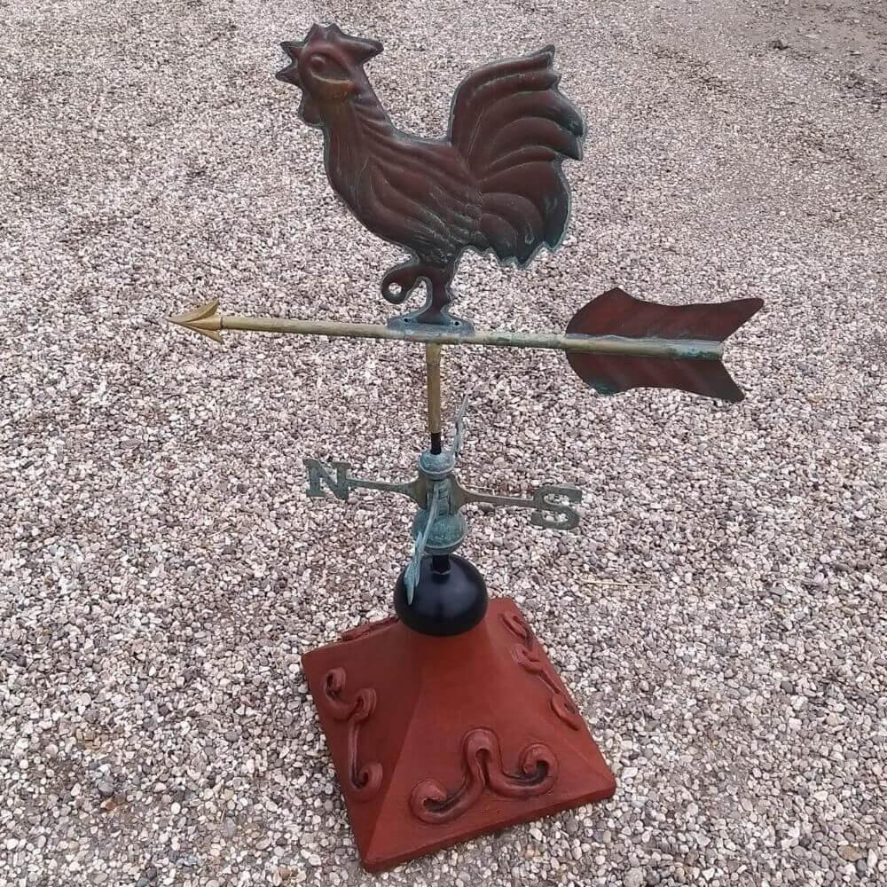 Cockerel weathervane fitted on a square roof tile capping