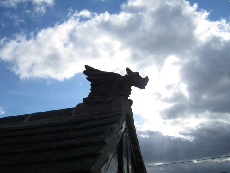 Half round terracotta roof dragon installed in Kent