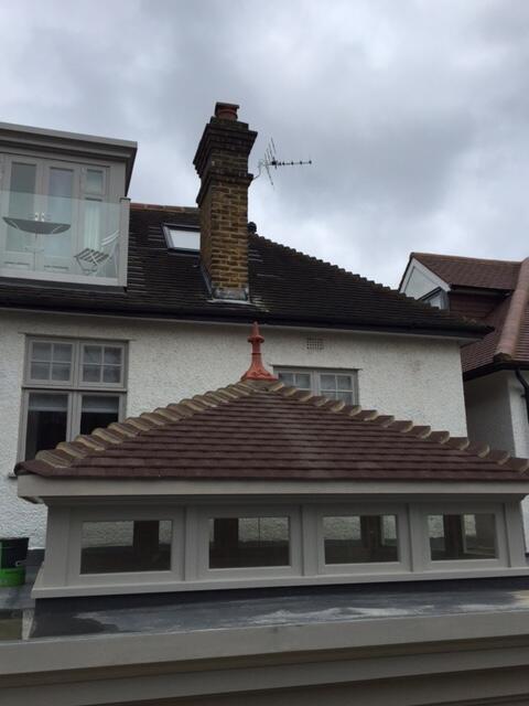 fleur de lys roof finial fitted on a square roof