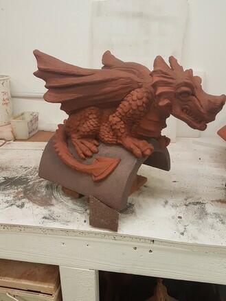 Redland granular brown two tone dragon roof finial in the workshop