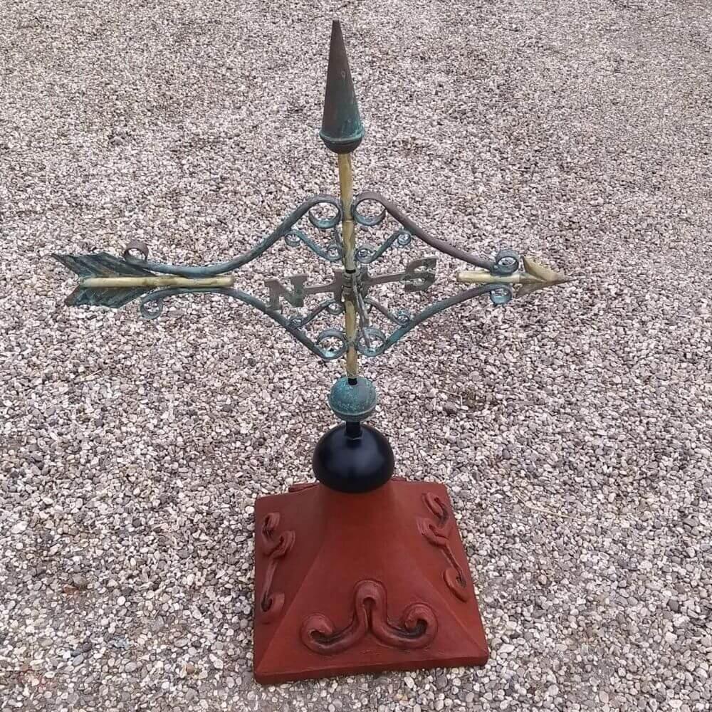 Victorian arrow weathervane fitted to a square ridge tile