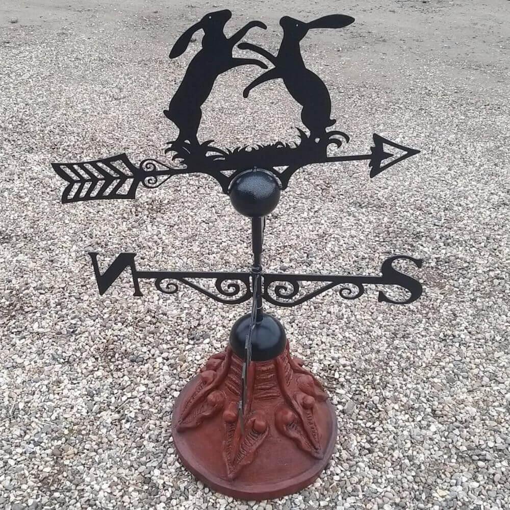 Boxing hares weathervane supplied on a round ridge tile capping