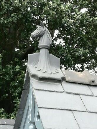 Slate grey horse roof finial on roof
