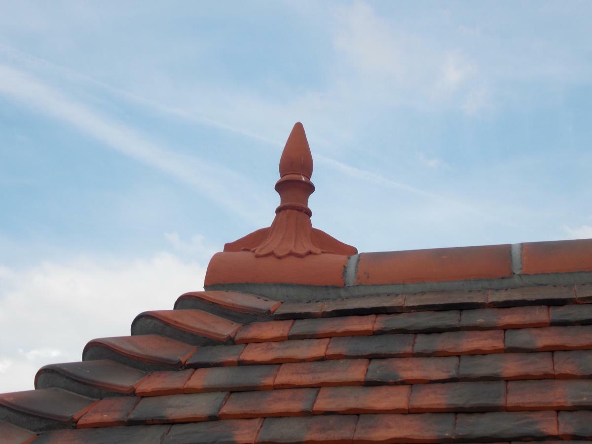 Half round spike finial on roof