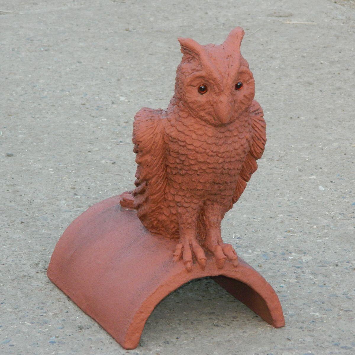 Owl roof finial ornament with eyes made of brown glass