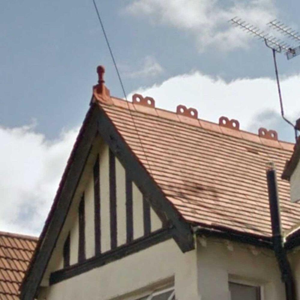 Victorian ball roof finial installed on a roof