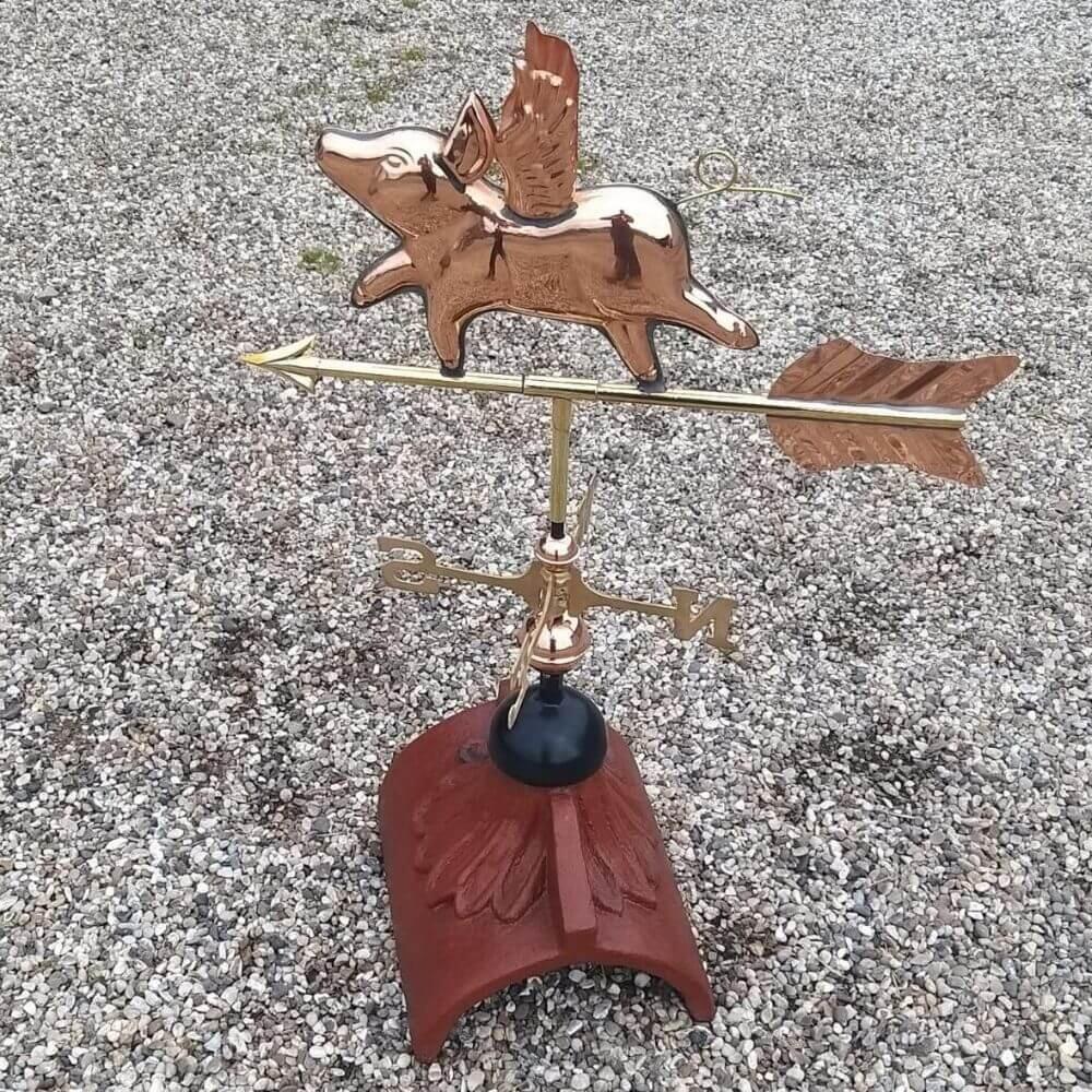 Flying pig weathervane supplied on a half round roof finial
