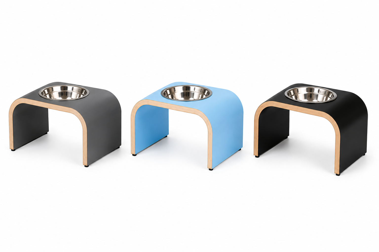Three handmade single raised pet bowl stands in powder blue, dark grey, and black finishes, each featuring a modern curved wooden design and a removable stainless steel bowl. Premium elevated feeders for cats and small dogs with durable, easy-clean laminate surfaces, displayed on a clean white background for easy colour comparison.