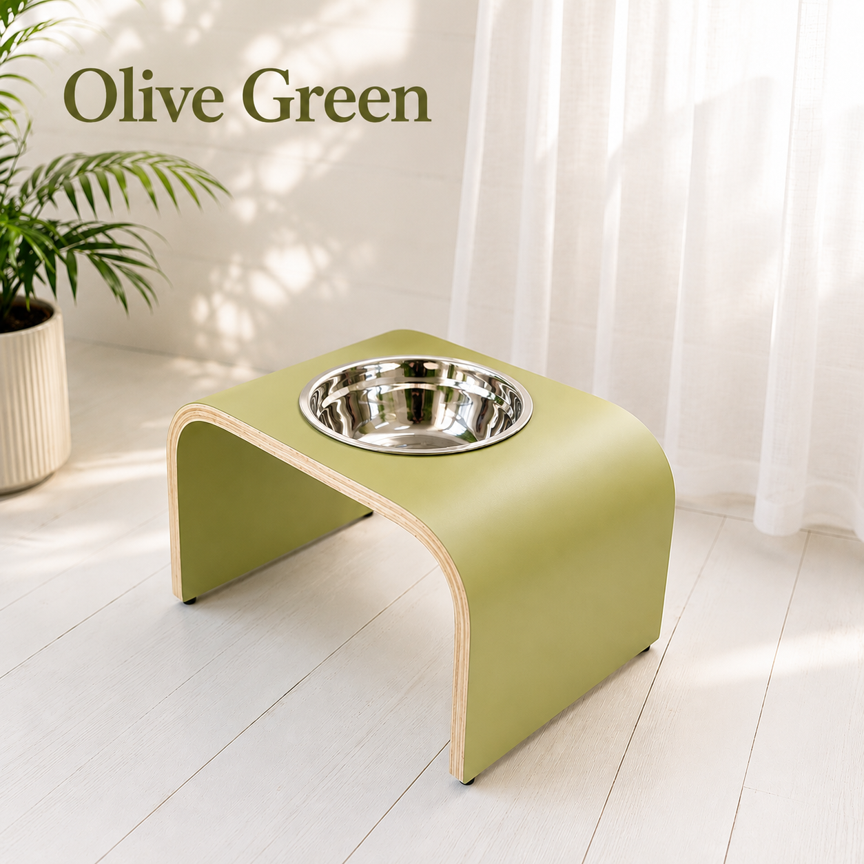 Handmade olive green raised dog bowl stand with stainless steel bowl, modern curved wooden elevated feeder for dogs and cats by Lola & Daisy Designer Pets.