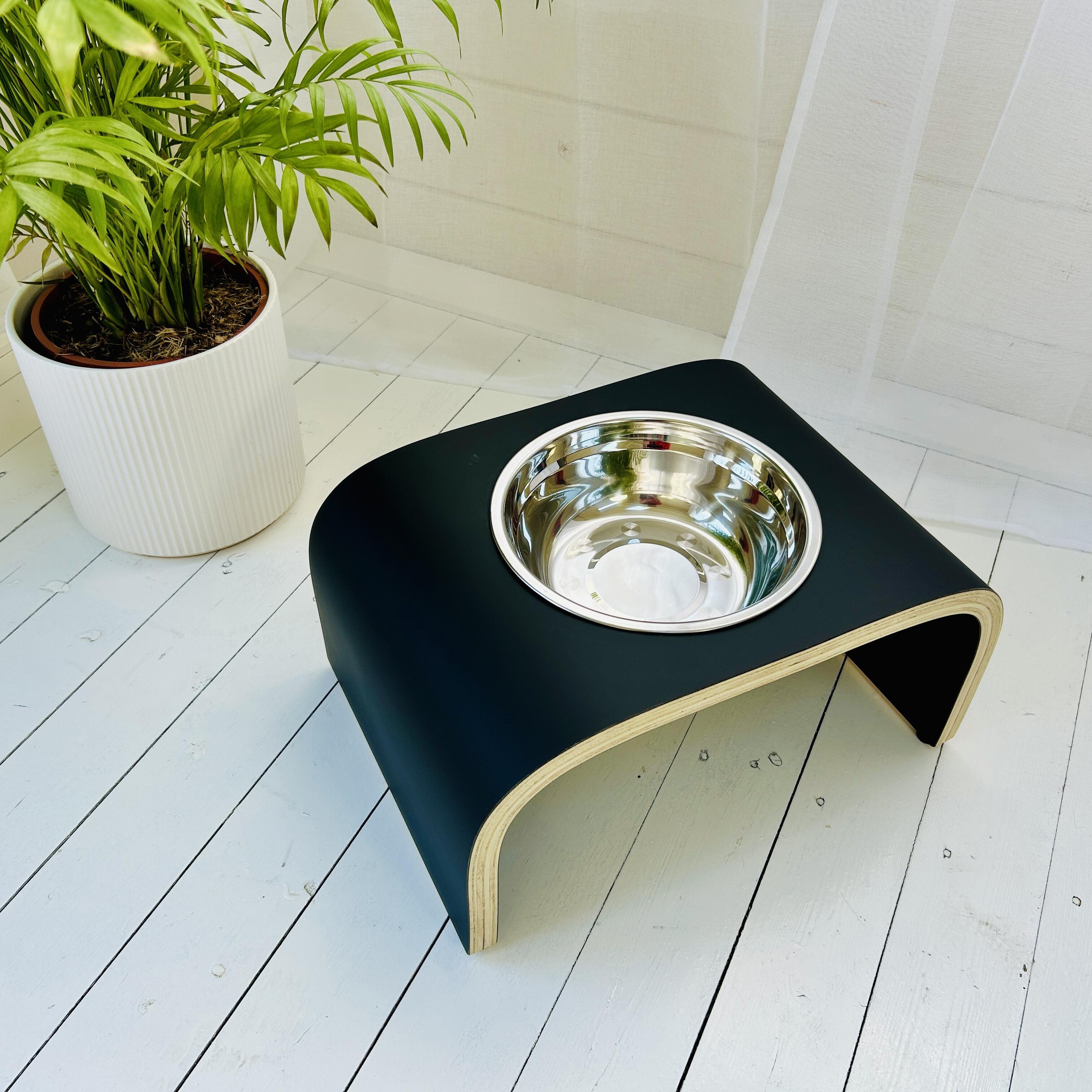 above view of single bowl dog feeder in matt black finish in white sun room