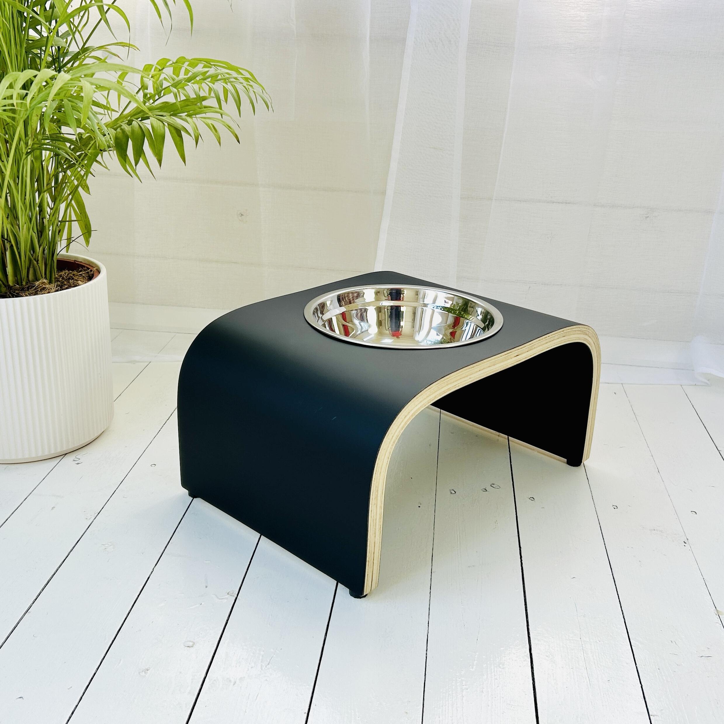 angled view of dog bowl stand in matt black finish