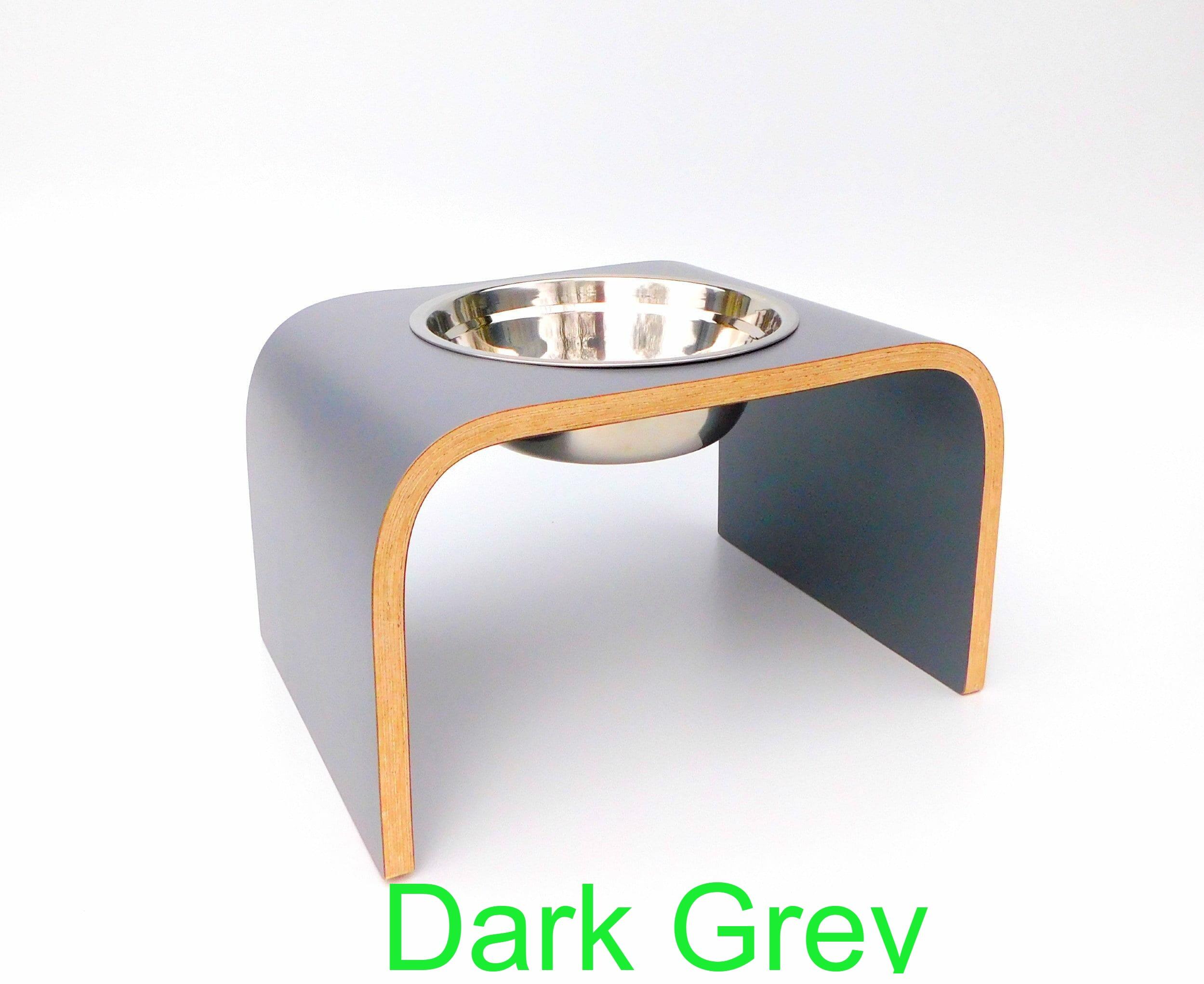 angled view of dark grey raised single dog bowl stand with stainless steel bowl